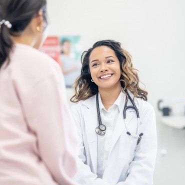 Nurse smiling at a patient