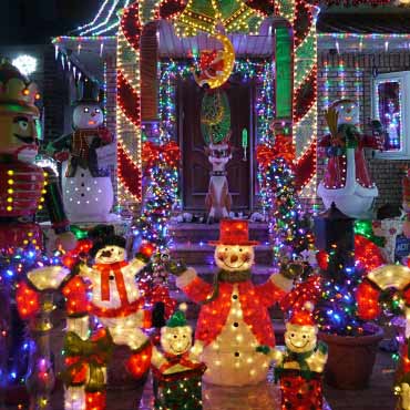 Home dressed in holiday lights and decor.