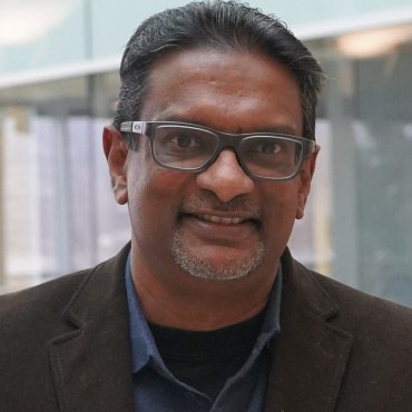 UBC Okanagan professor Dr. Kasun Hewage stands in the Engineering, Management and Education Building.