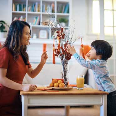 Person with child celebrating Lunar New Year